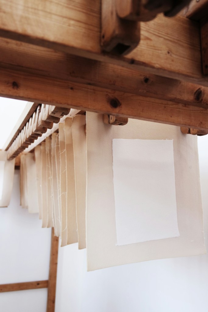 Handmade paper on couching sheets and hung to dry.